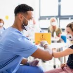 CTE trained student working in his career providing vaccines
